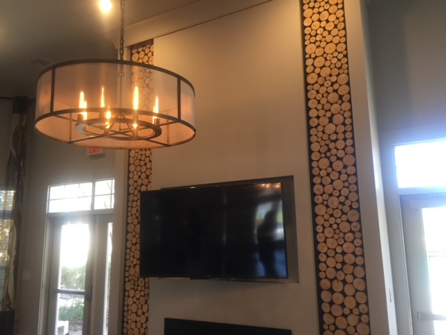 commercial tv design with wood log accent