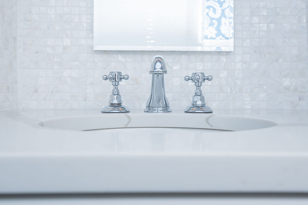 sink with chrome handles